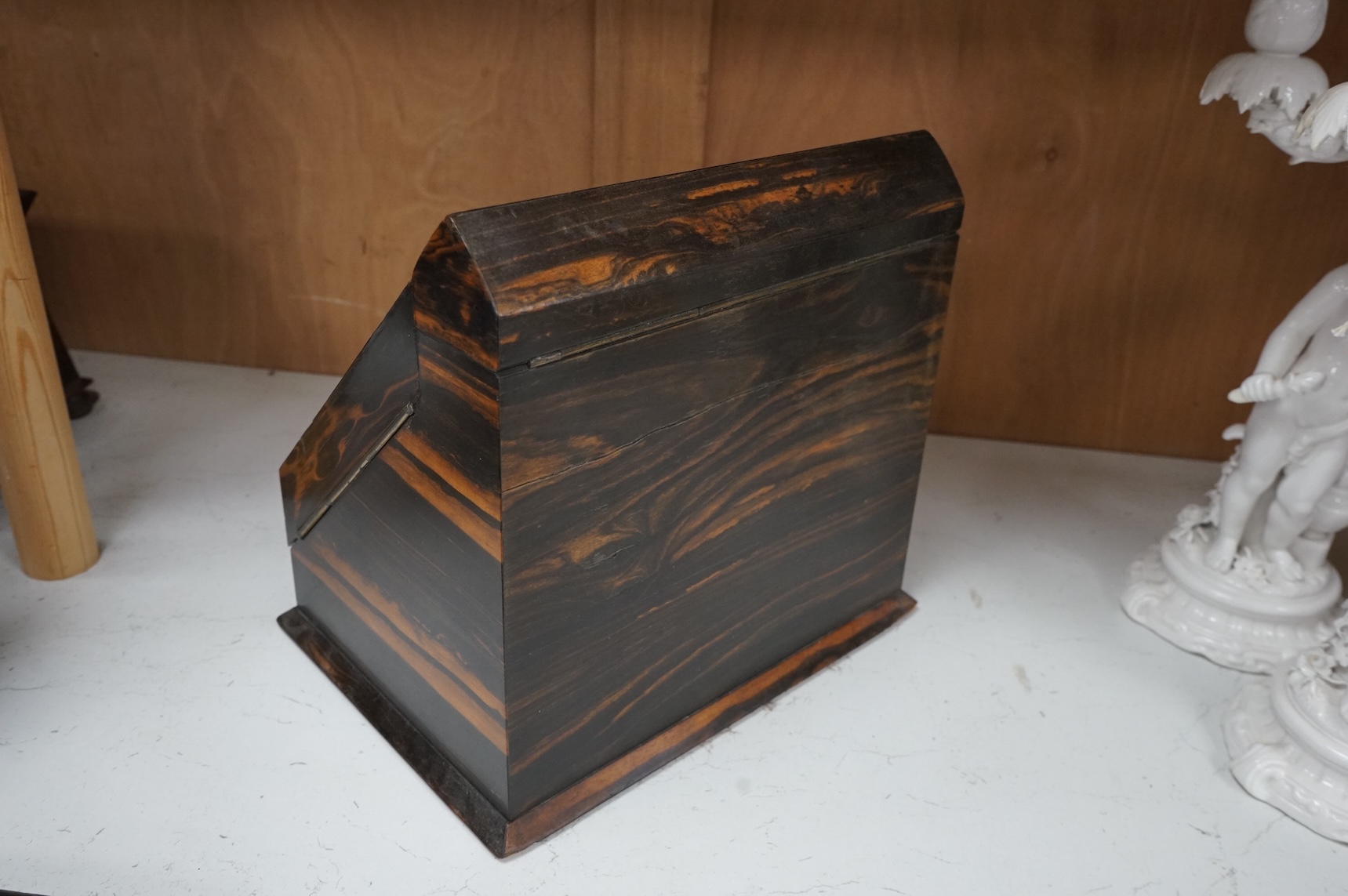 A coromandel desk top stationery box with letter rack and calendar, 29cm wide